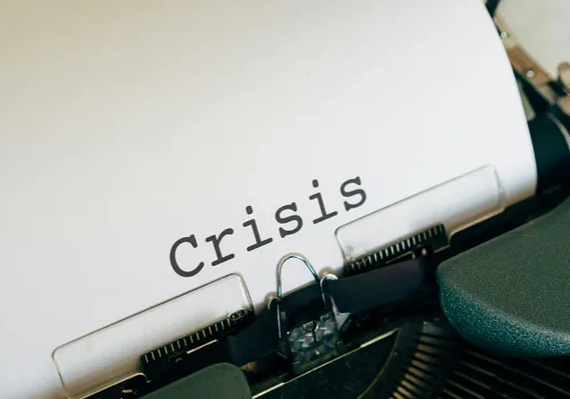 Vintage typewriter with the word "Crisis